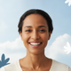 Portrait of a happy woman in her 30s smiling contentedly, reflecting trust and satisfaction against a soft blue background.